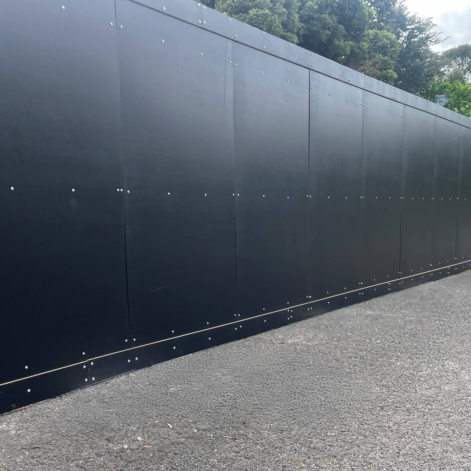 A photo of STRUCTApanel® hoarding used in an outdoor setting