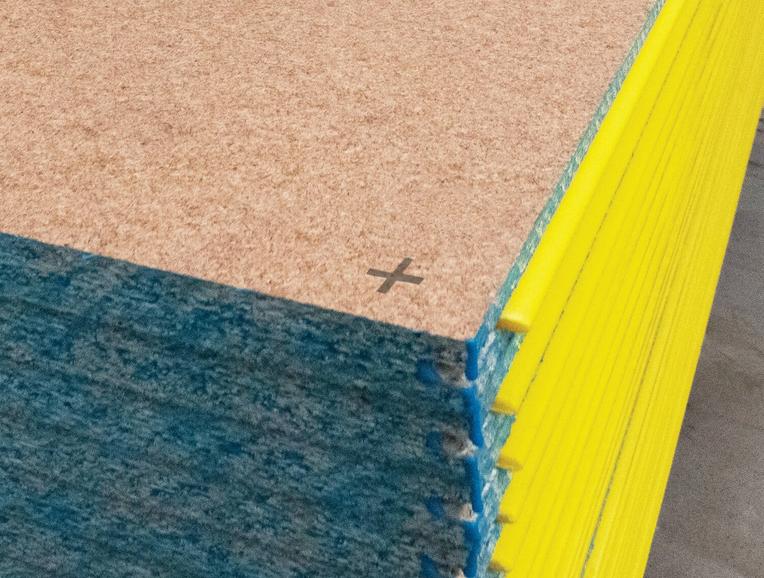 A close-up photo of stacked STRUCTAflor® Termite Treated panels