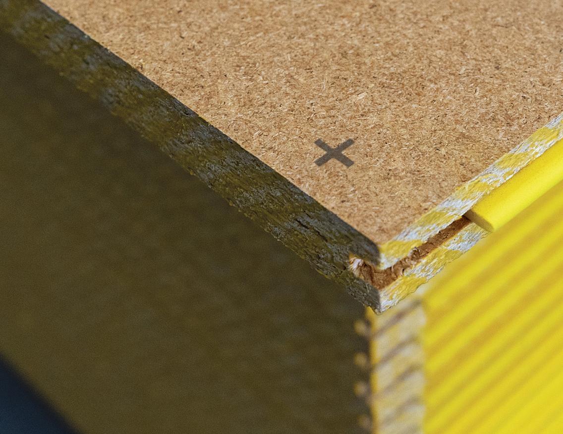 Close up of STRUCTAflor® YELLOWtongue® flooring installation crosshairs